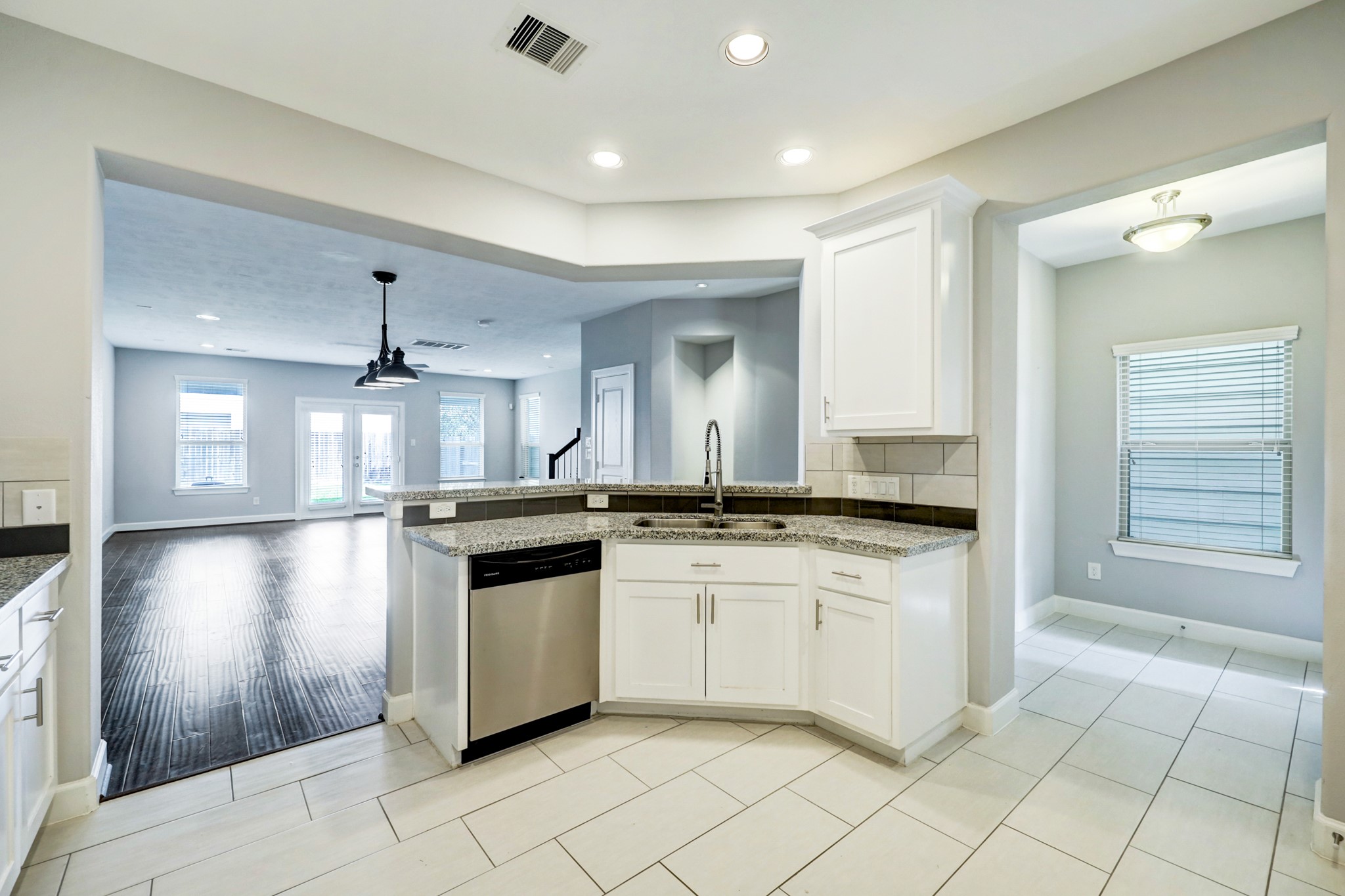1811 Wichita Street, Unit A Houston, TX 77004 - Photo 8 of 29 a kitchen with granite countertop a sink and cabinets