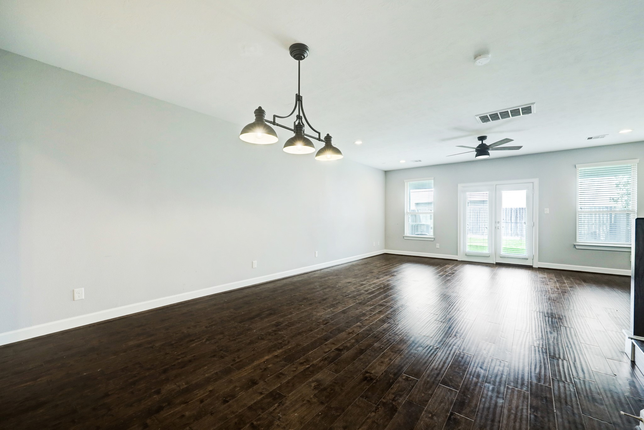 1811 Wichita Street, Unit A Houston, TX 77004 - Photo 9 of 29 a view of empty room with wooden floor and window