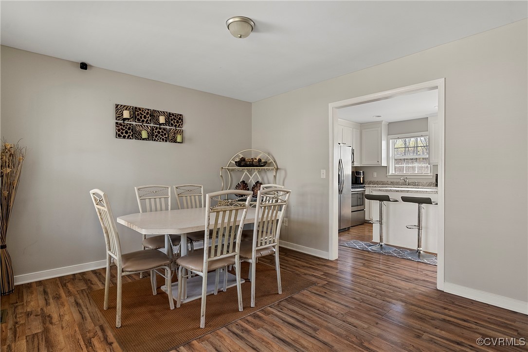 7553 Rolling Hill Road Hopewell, VA 23860 - Photo 18 of 35 Dining area featuring dark wood-type flooring and