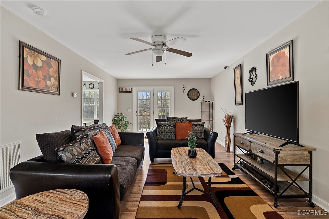 7553 Rolling Hill Road Hopewell, VA 23860 - Photo 7 of 35 Living room with ceiling fan and hardwood / wood-s