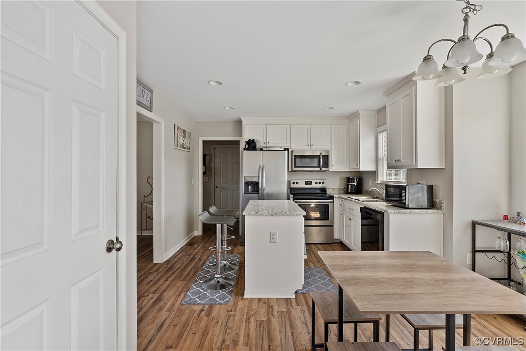 7553 Rolling Hill Road Hopewell, VA 23860 - Photo 10 of 35 Kitchen featuring light hardwood / wood-style floo