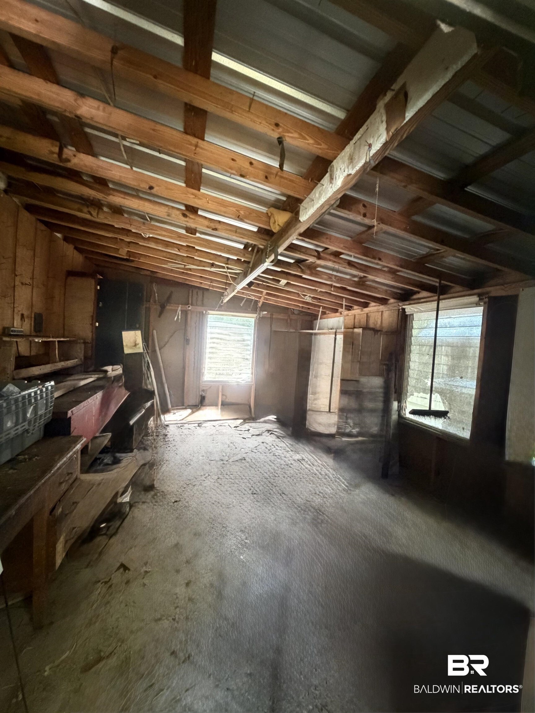 1354 Caney Loop Lillian, AL 36549 - Photo 25 of 45 Exposed wood beam ceiling with metal roofing