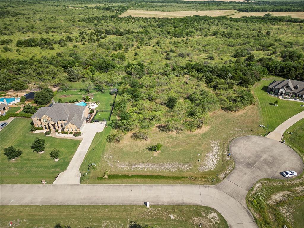 540 Austin Circle, Unit A Terrell, TX 75160 - Photo 2 of 11 a view of a swimming pool with a yard