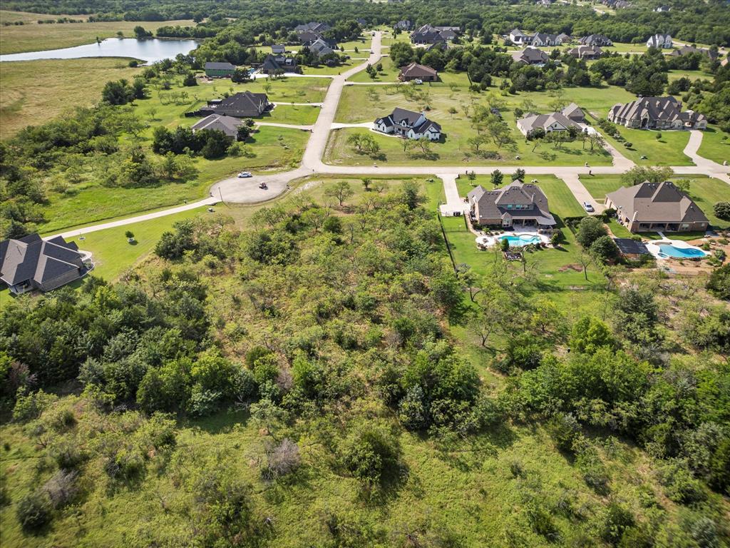 540 Austin Circle, Unit A Terrell, TX 75160 - Photo 6 of 11 an aerial view of residential houses with outdoor space and trees