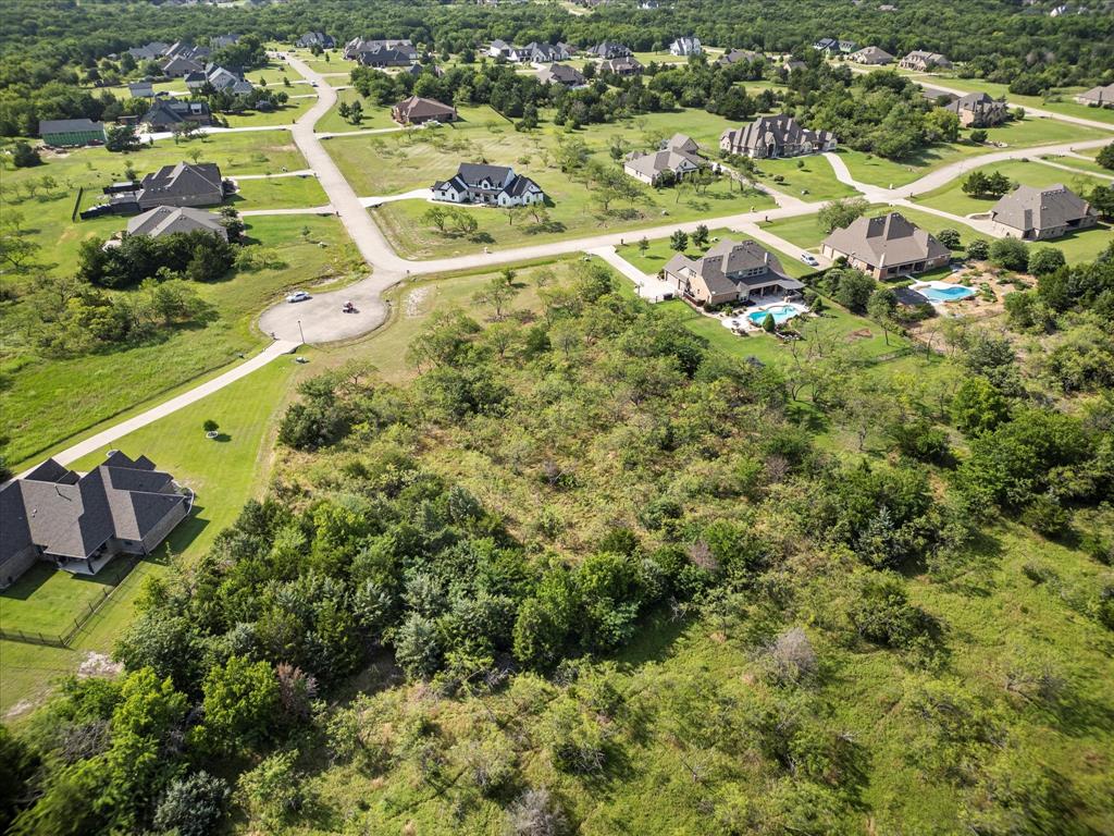 540 Austin Circle, Unit A Terrell, TX 75160 - Photo 7 of 11 an aerial view of residential houses with outdoor space and trees