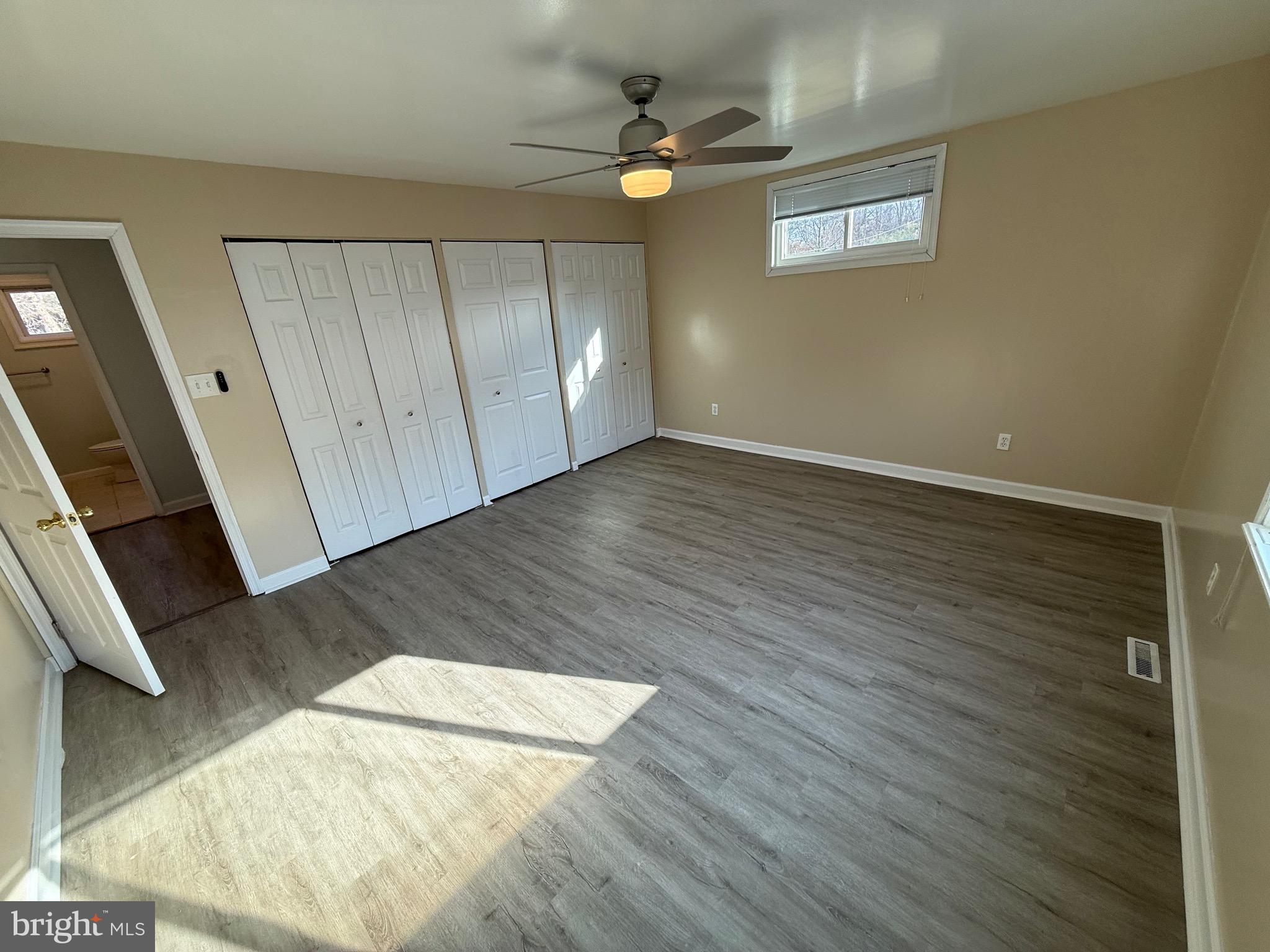 1214 Reece Road Severn, MD 21144 - Photo 17 of 25 wooden floor in an empty room with a window