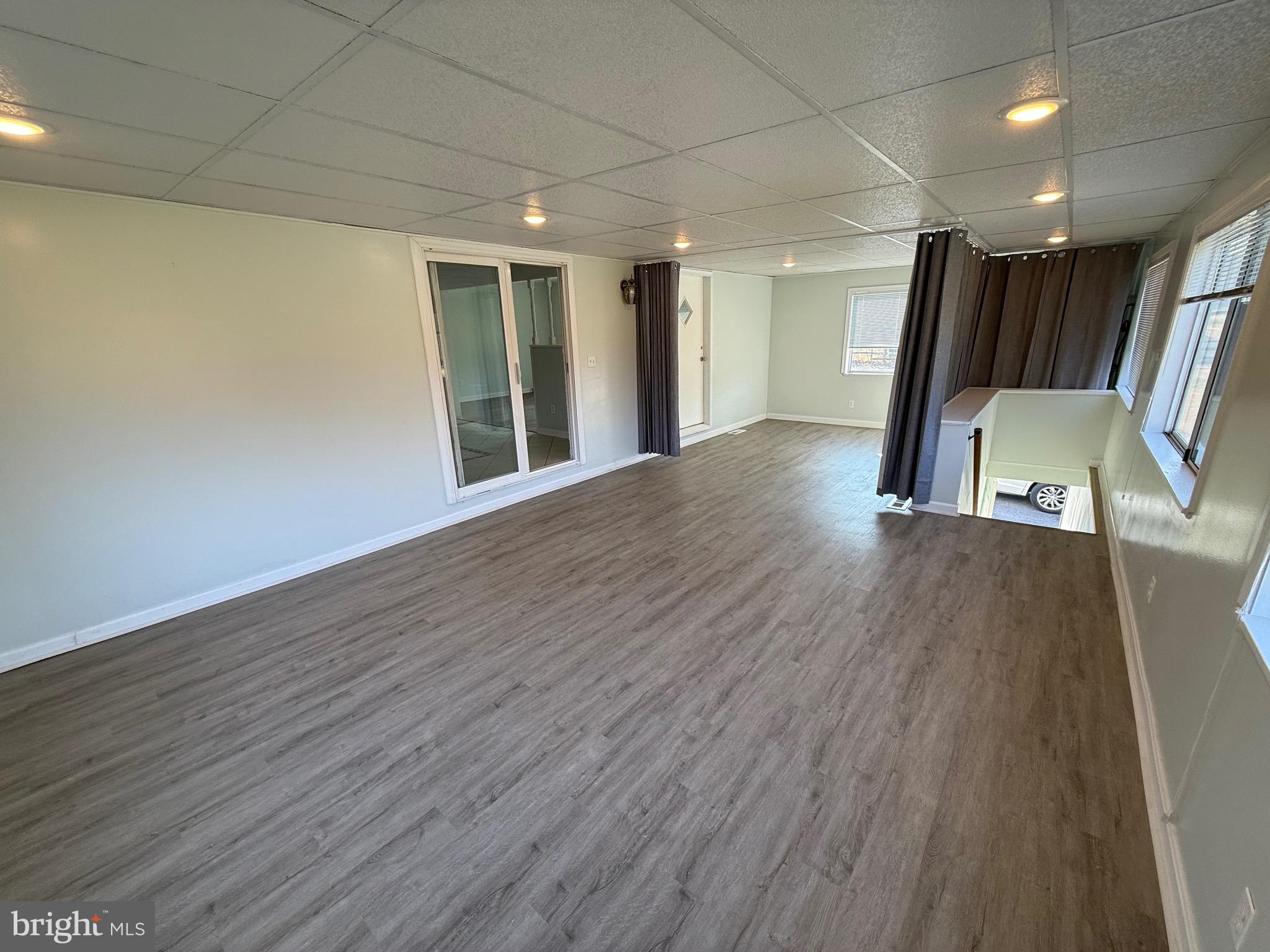 1214 Reece Road Severn, MD 21144 - Photo 10 of 25 a view of a hallway with wooden floor