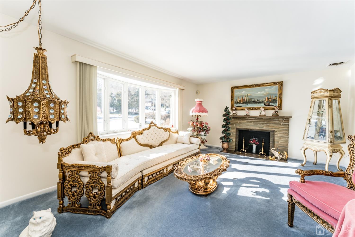283 Baltusrol Way Springfield, NJ 07081 - Photo 4 of 20 a bedroom with bed and a fireplace