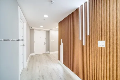 a view of a dining room with furniture and a floor to ceiling window