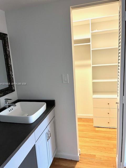 3920 Inverrary Boulevard, Unit 204C Lauderhill, FL 33319 - Photo 11 of 19 a bathroom with a sink and a mirror
