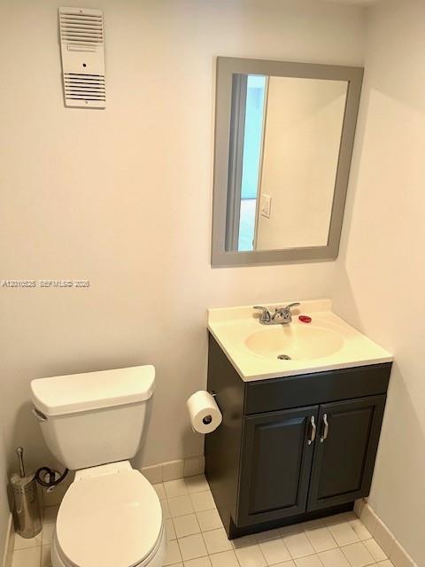 3920 Inverrary Boulevard, Unit 204C Lauderhill, FL 33319 - Photo 12 of 19 a bathroom with a sink toilet and a mirror