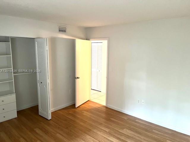 3920 Inverrary Boulevard, Unit 204C Lauderhill, FL 33319 - Photo 16 of 19 a view of empty room with wooden floor