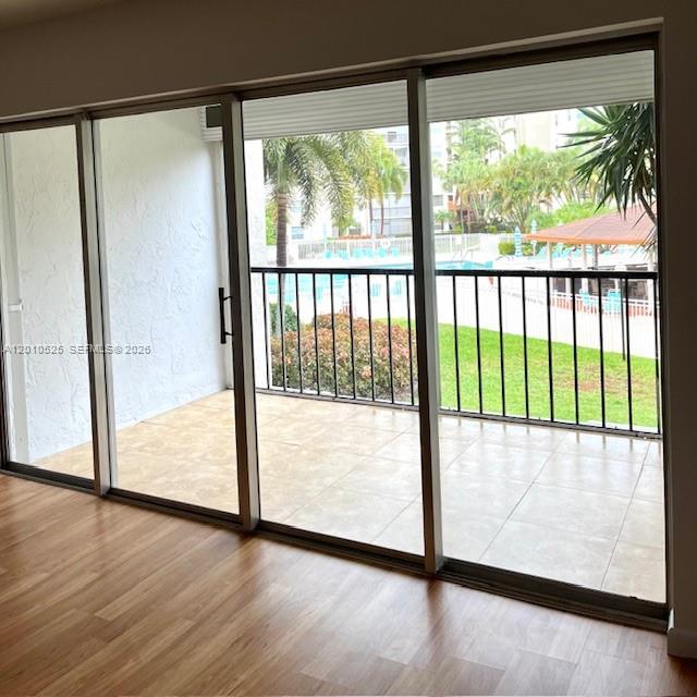 3920 Inverrary Boulevard, Unit 204C Lauderhill, FL 33319 - Photo 19 of 19 a view of a glass door with wooden floor