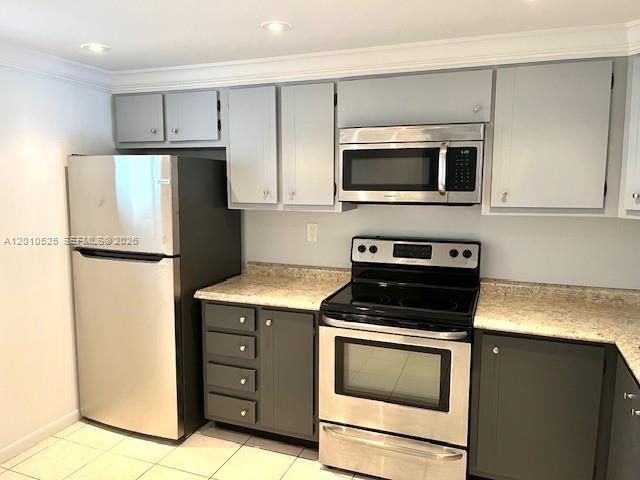 3920 Inverrary Boulevard, Unit 204C Lauderhill, FL 33319 - Photo 4 of 19 a kitchen with a stove microwave and refrigerator
