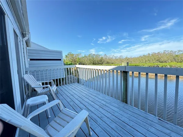 a view of a chairs on the roof deck