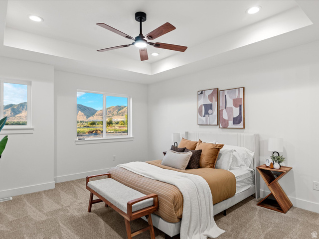 1267 West 2350 South Perry, UT 84302 - Photo 24 of 35 Recessed ceiling with integrated lighting and a ceiling fan, dual windows, and wall-to-wall carpeting