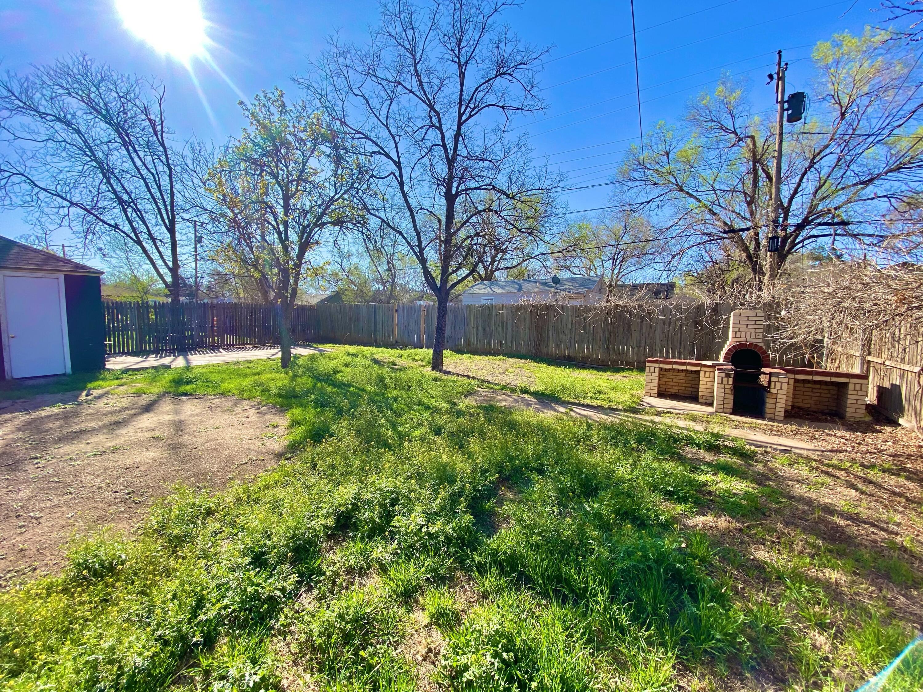 2209 28th Street Lubbock, TX 79411 - Photo 12 of 12 a view of swimming pool with a yard