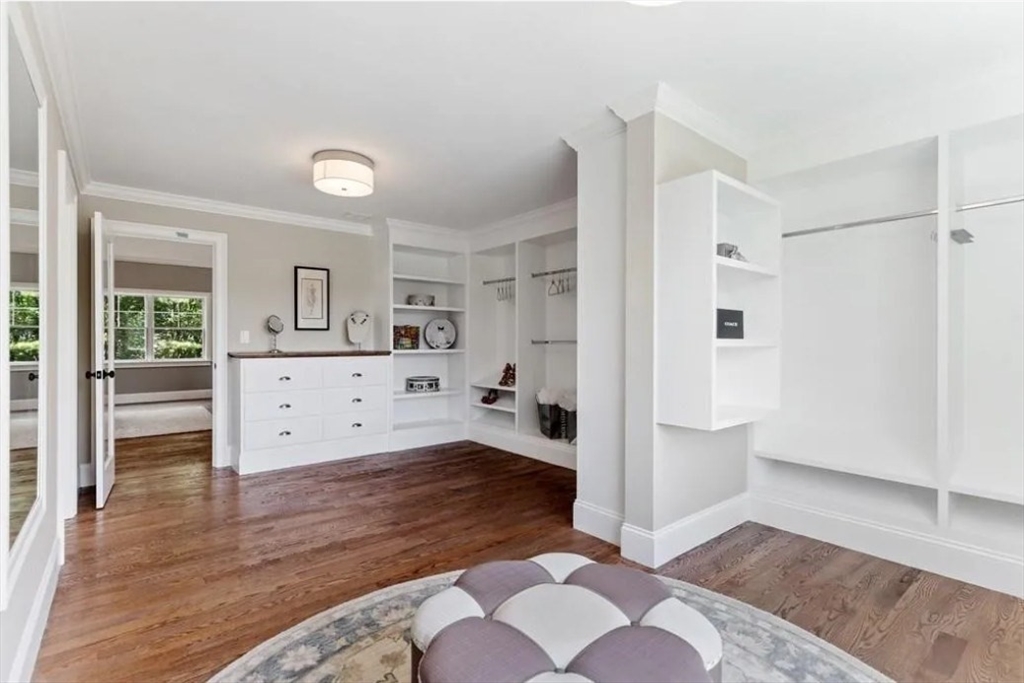 56 Blossomcrest Road Lexington, MA 02421 - Photo 14 of 19 a view of a room with wooden floor and cabinet