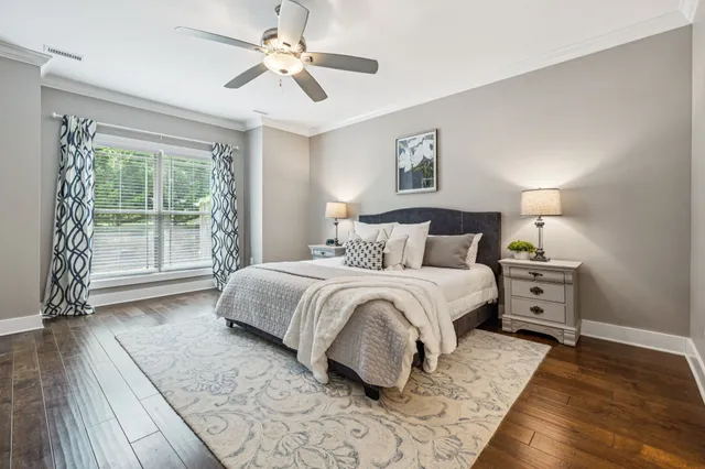 a bedroom with a large bed and a window