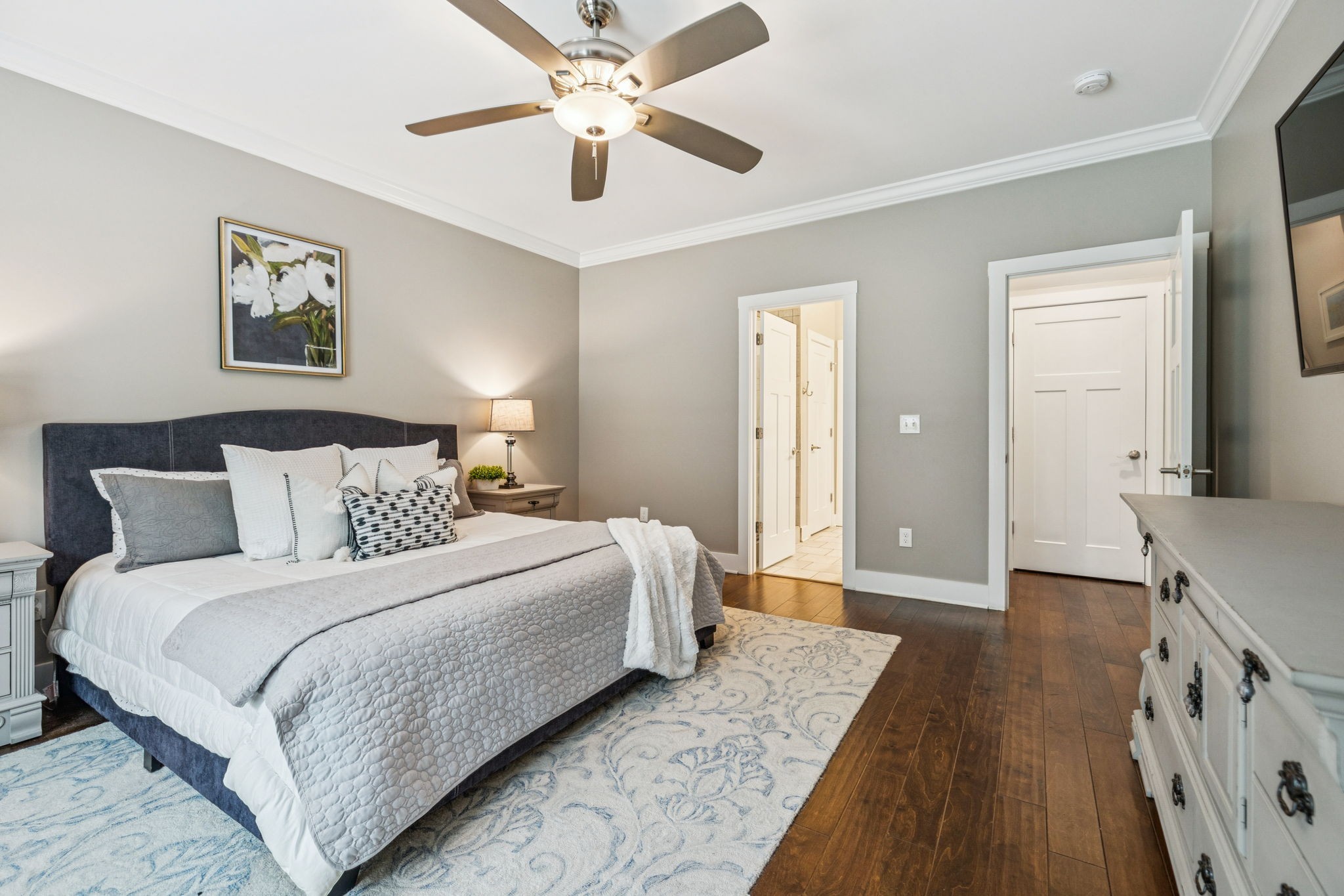 146 Island Way Winchester, TN 37398 - Photo 19 of 49 a bedroom with a large bed and a chandelier