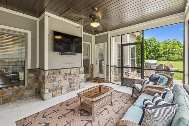 a living room with furniture and a flat screen tv