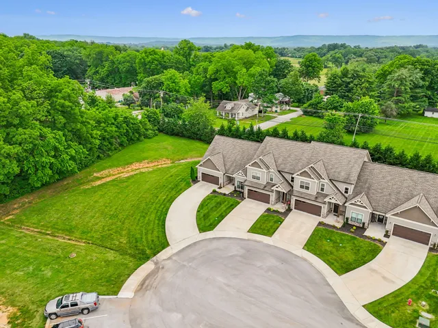 an aerial view of a house with garden