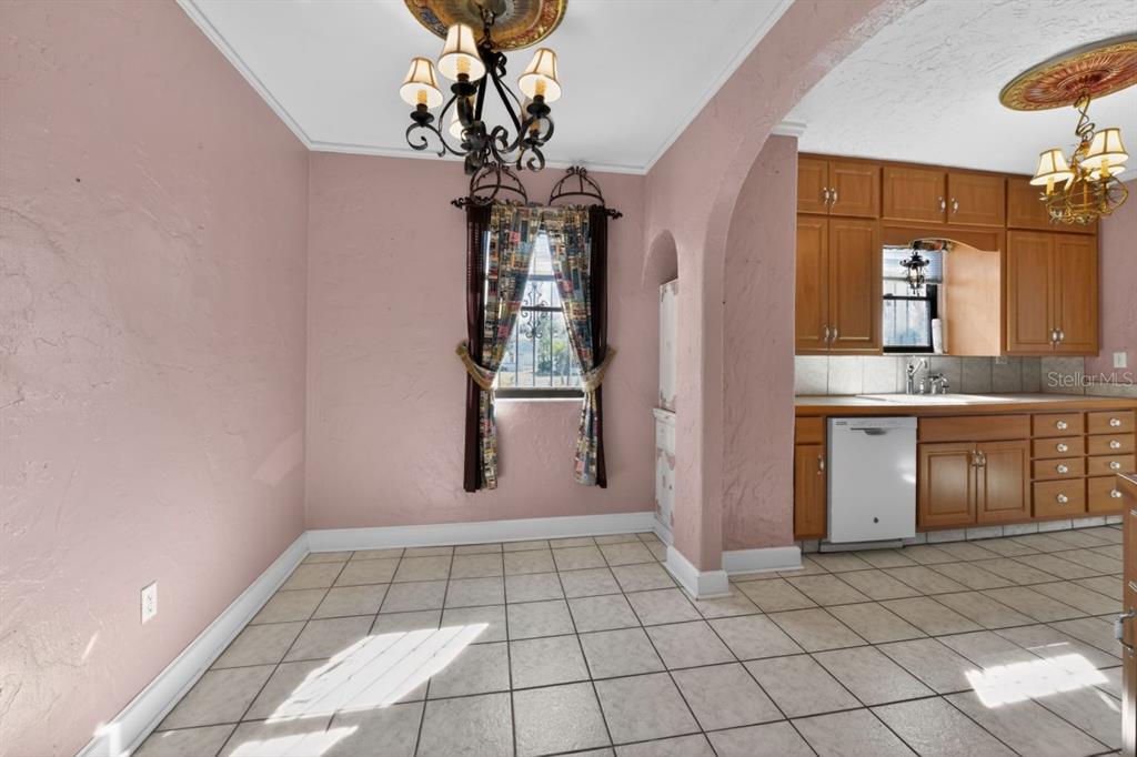 328 Sorrento Street Venice, FL 34285 - Photo 13 of 49 a view of entryway with a chandelier fan and windows