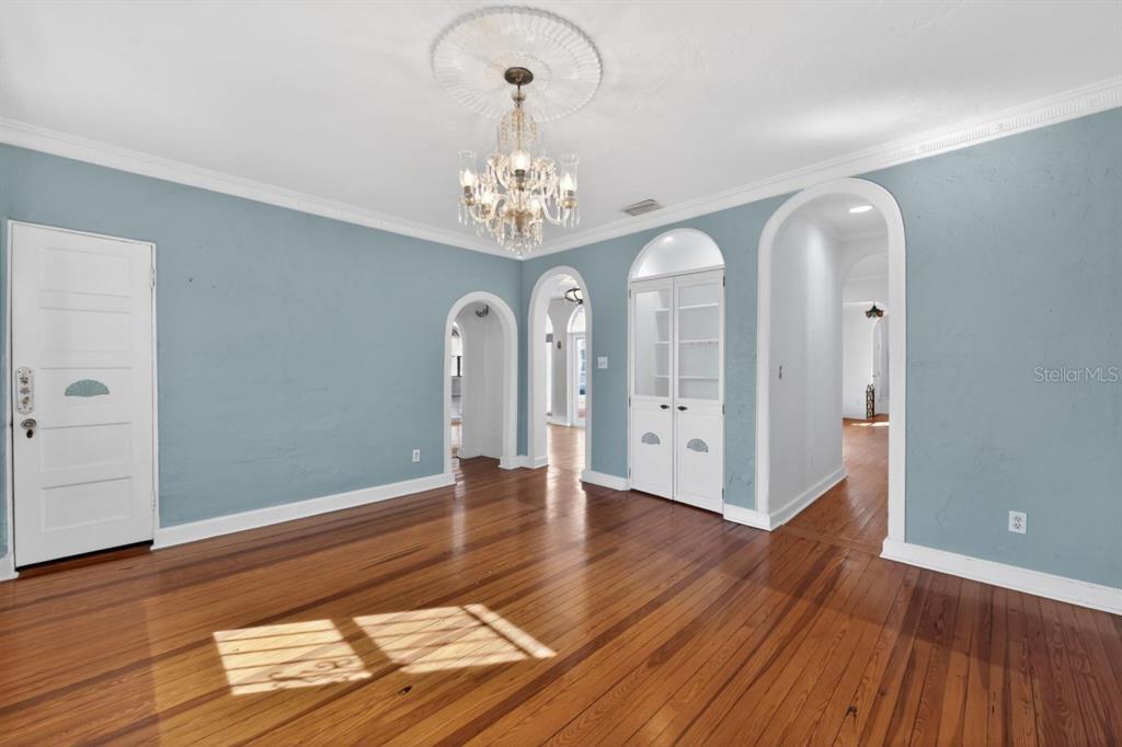 328 Sorrento Street Venice, FL 34285 - Photo 17 of 49 a view of an empty room with wooden floor