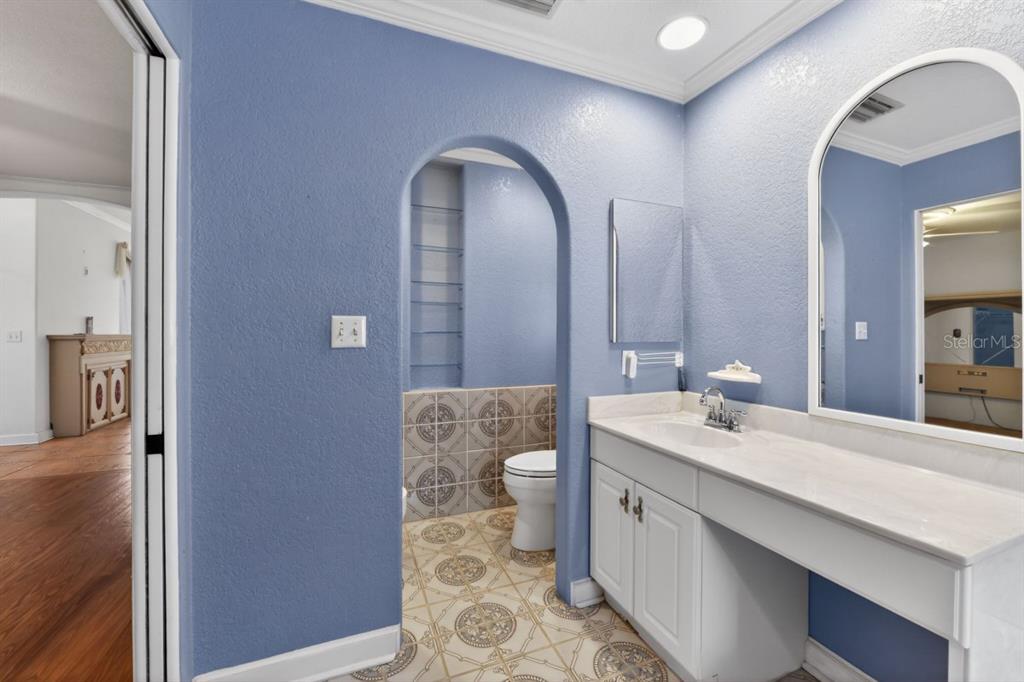 328 Sorrento Street Venice, FL 34285 - Photo 23 of 49 a spacious bathroom with a double vanity sink and a mirror