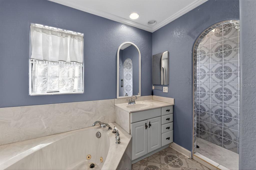 328 Sorrento Street Venice, FL 34285 - Photo 25 of 49 a bath room with a sink and a mirror