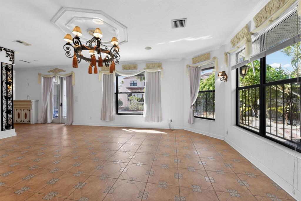 328 Sorrento Street Venice, FL 34285 - Photo 30 of 49 a view of a room with a chandelier