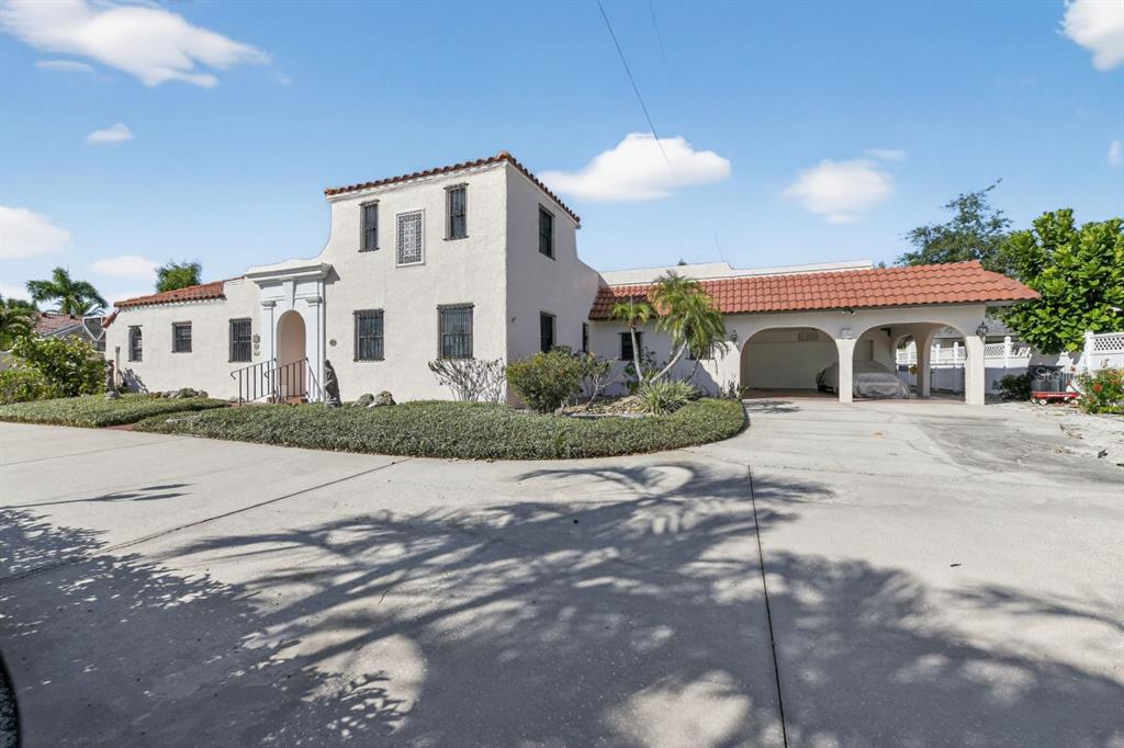 328 Sorrento Street Venice, FL 34285 - Photo 3 of 49 a front view of a house with a yard and garage