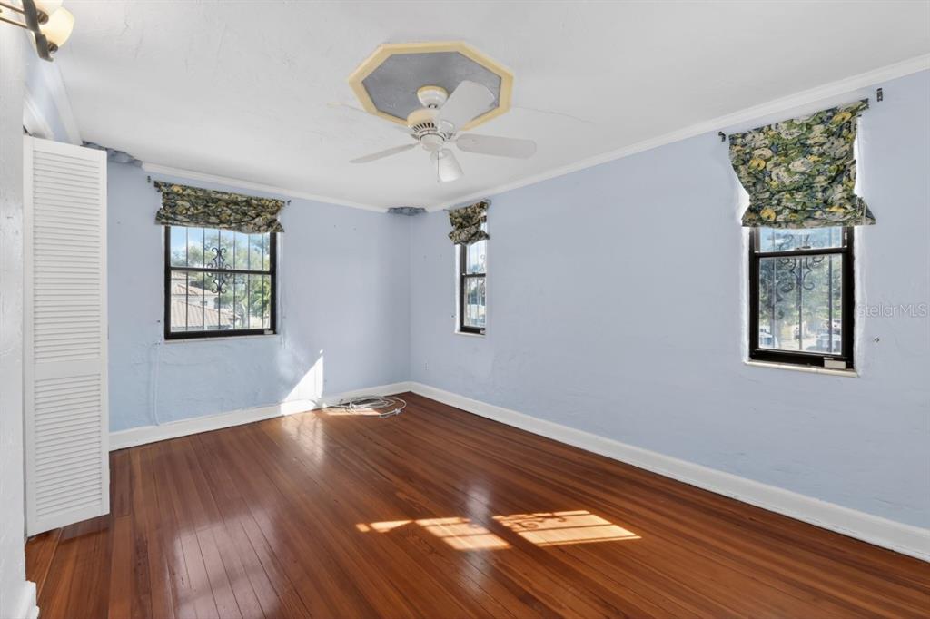 328 Sorrento Street Venice, FL 34285 - Photo 34 of 49 a view of an empty room with wooden floor and a window