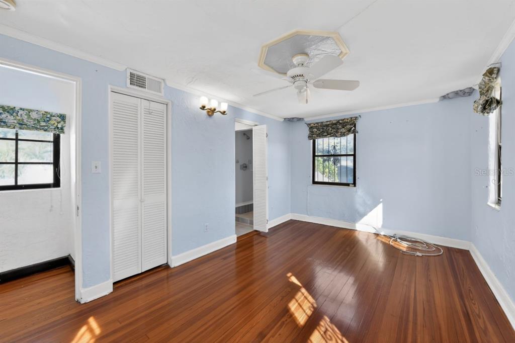 328 Sorrento Street Venice, FL 34285 - Photo 35 of 49 an empty room with wooden floor chandelier and windows