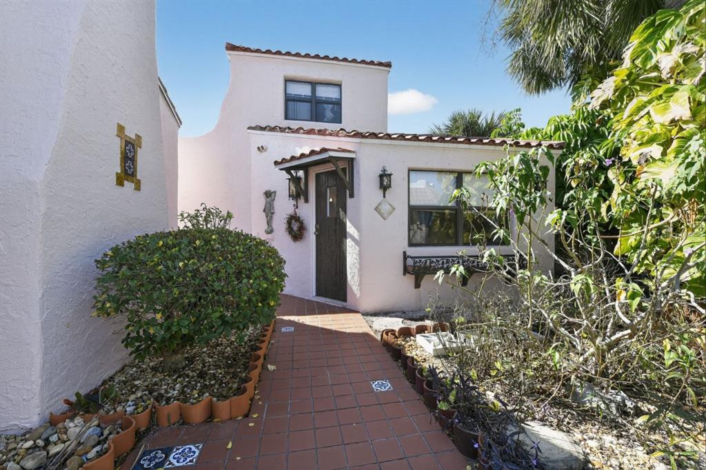 328 Sorrento Street Venice, FL 34285 - Photo 38 of 49 a front view of a house with garden