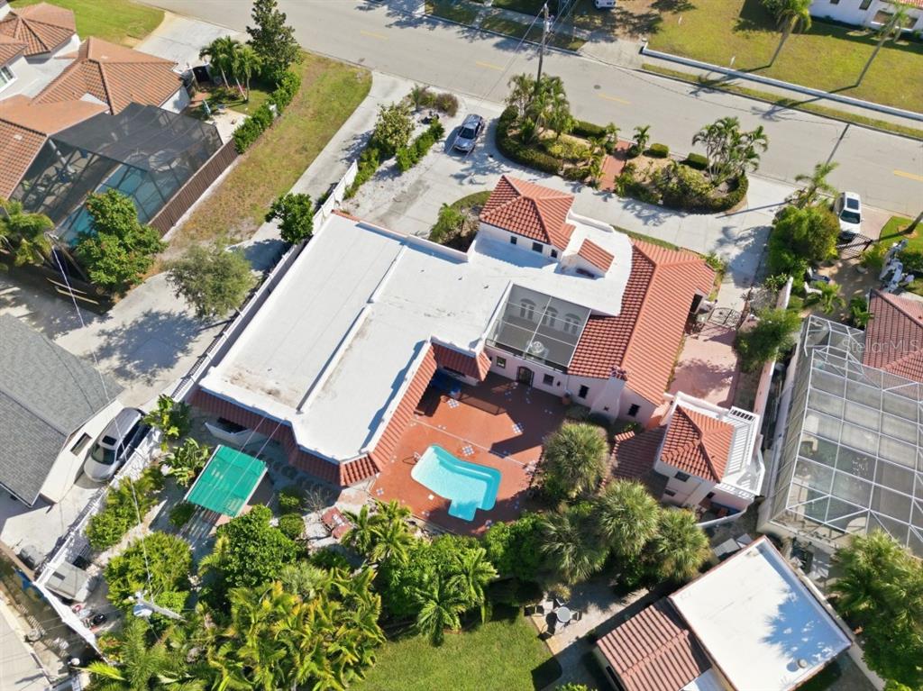 328 Sorrento Street Venice, FL 34285 - Photo 6 of 49 an aerial view of a house with a garden and swimming pool