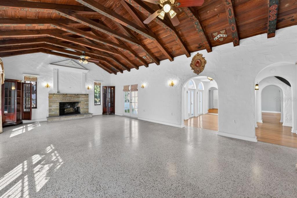 328 Sorrento Street Venice, FL 34285 - Photo 8 of 49 a view of empty room with fireplace and wooden floor