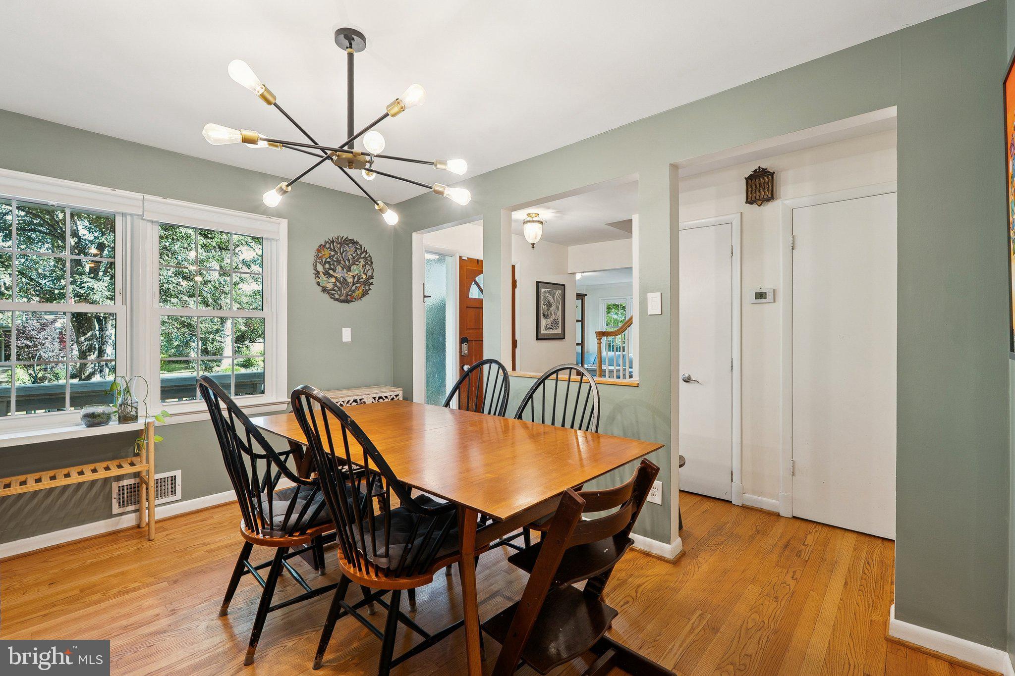 1432 Crestridge Drive Silver Spring, MD 20910 - Photo 11 of 52 a view of a dining room with furniture window and wooden floor