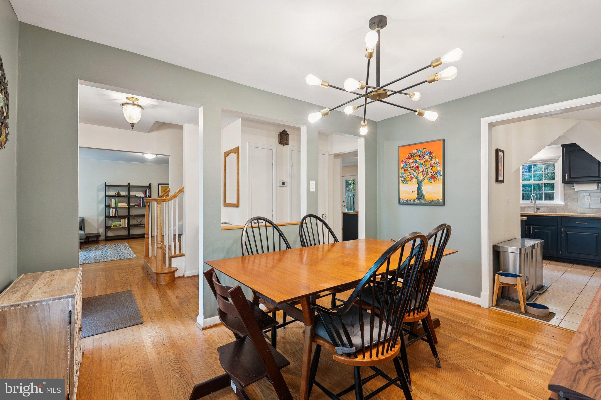 1432 Crestridge Drive Silver Spring, MD 20910 - Photo 12 of 52 a view of a dining room with furniture and wooden floor