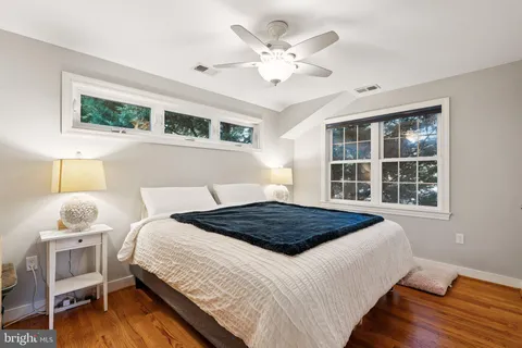 a bedroom with a large bed and a window