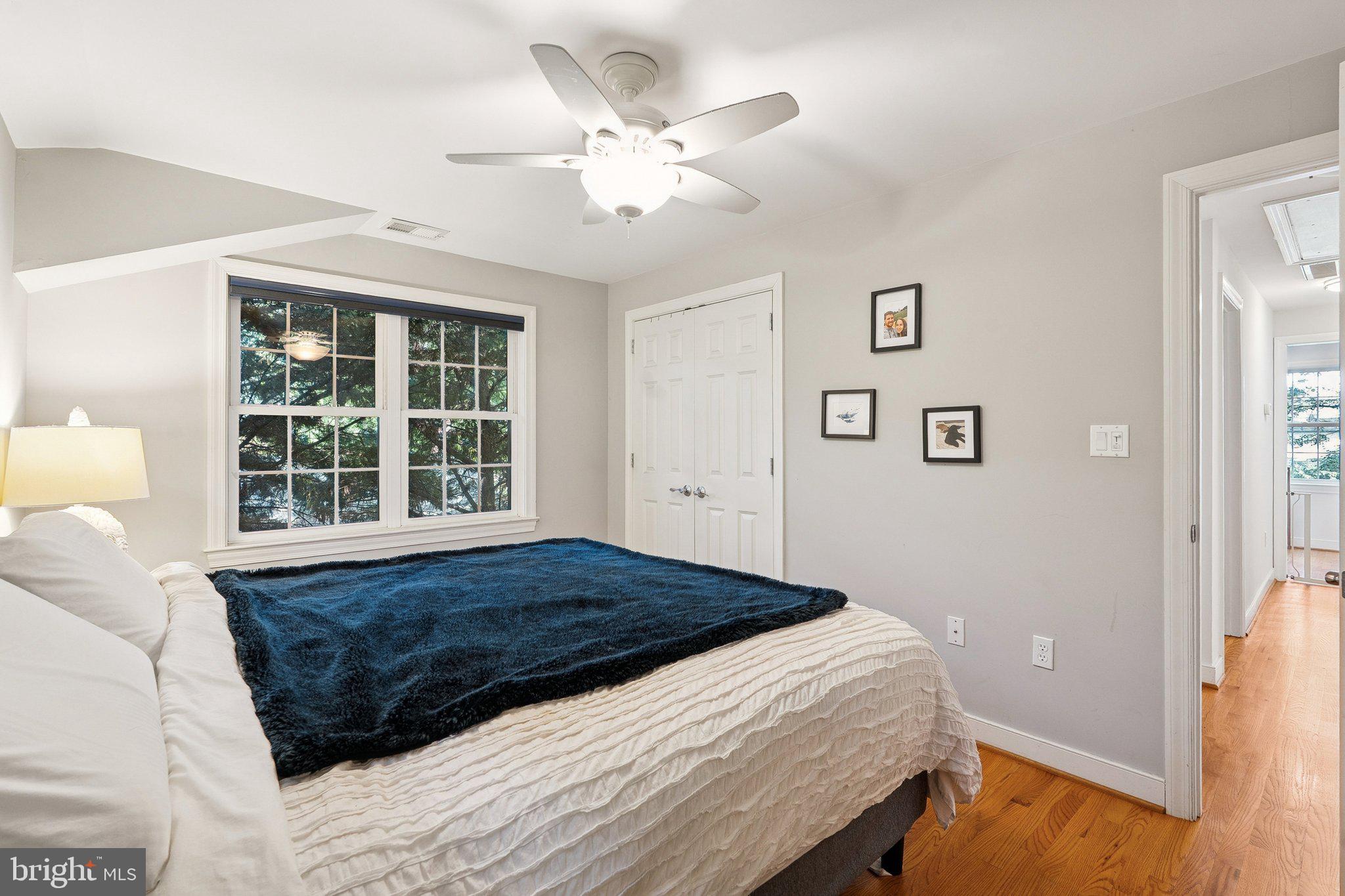 1432 Crestridge Drive Silver Spring, MD 20910 - Photo 18 of 52 a bed sitting in a bedroom next to a window