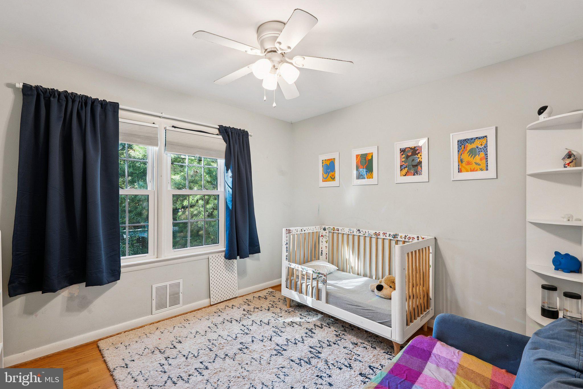 1432 Crestridge Drive Silver Spring, MD 20910 - Photo 23 of 52 a bedroom with furniture and a window