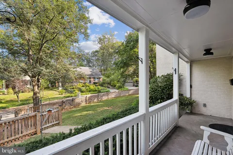a view of a porch and garden