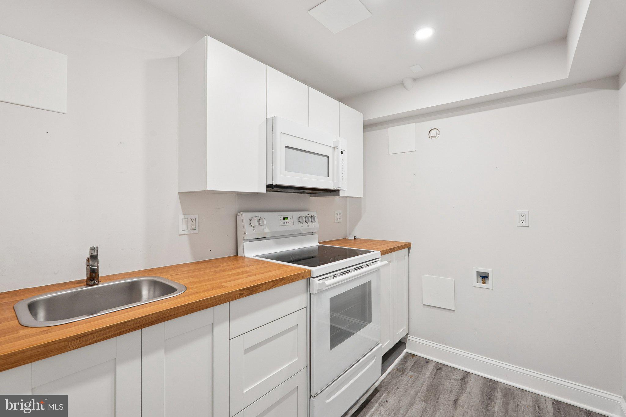 1432 Crestridge Drive Silver Spring, MD 20910 - Photo 29 of 52 a utility room with dryer and washer