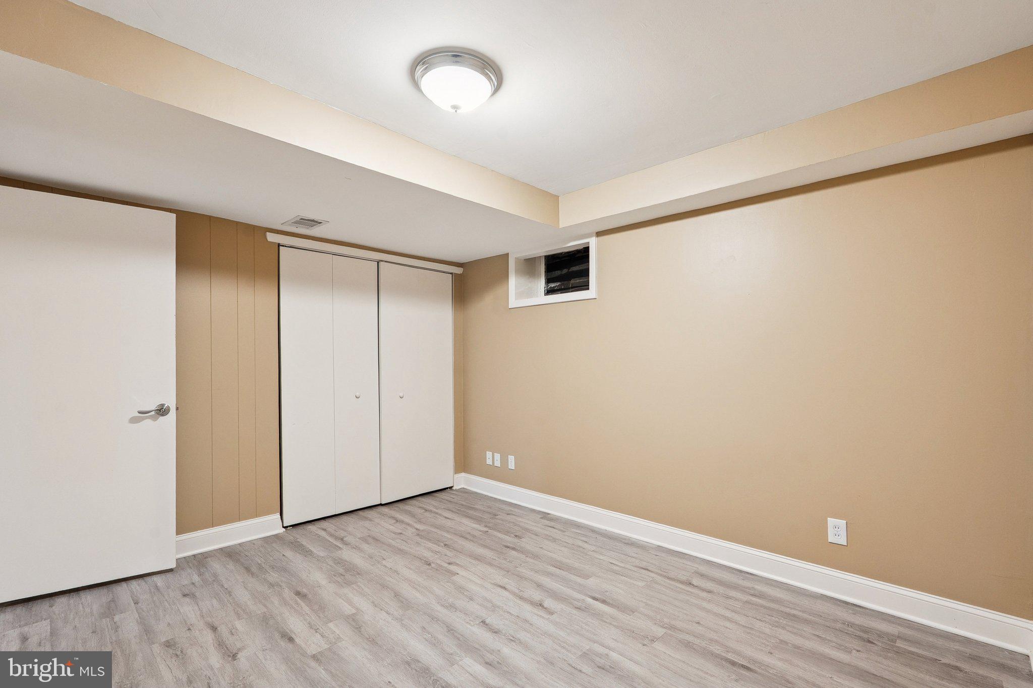 1432 Crestridge Drive Silver Spring, MD 20910 - Photo 34 of 52 a view of an empty room with wooden floor
