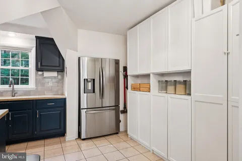 a kitchen with stainless steel appliances a refrigerator and a sink