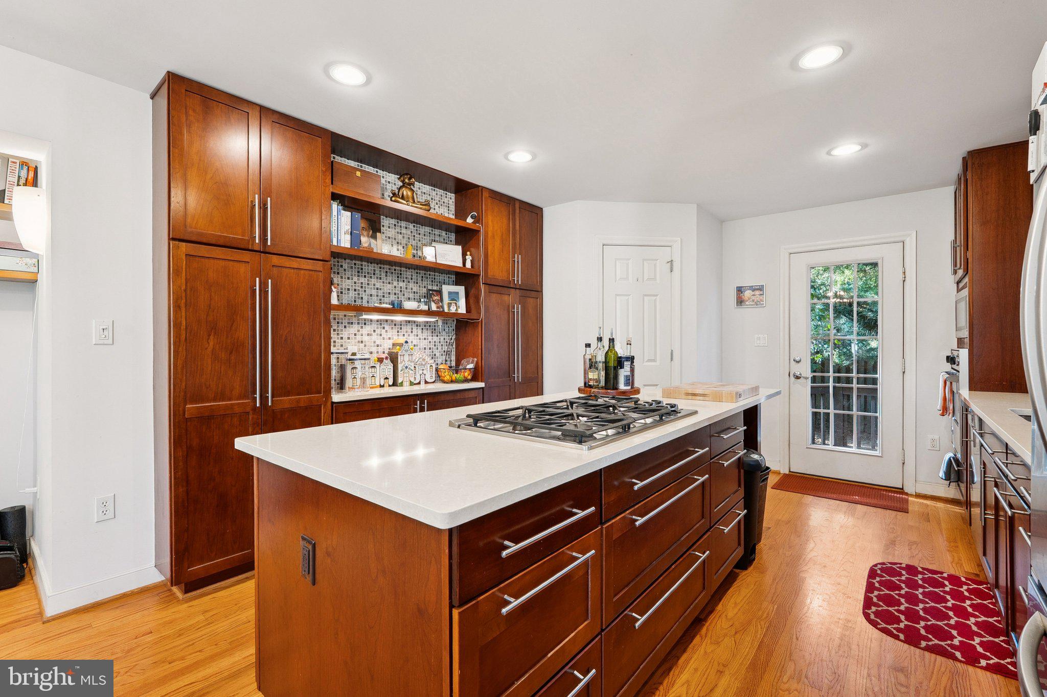 1432 Crestridge Drive Silver Spring, MD 20910 - Photo 6 of 52 a kitchen with a stove and a wooden cabinets