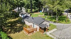 a view of a backyard with plants and a park