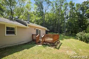 a view of a small house in the backyard