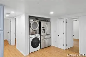 a view of a hallway with washer and dryer